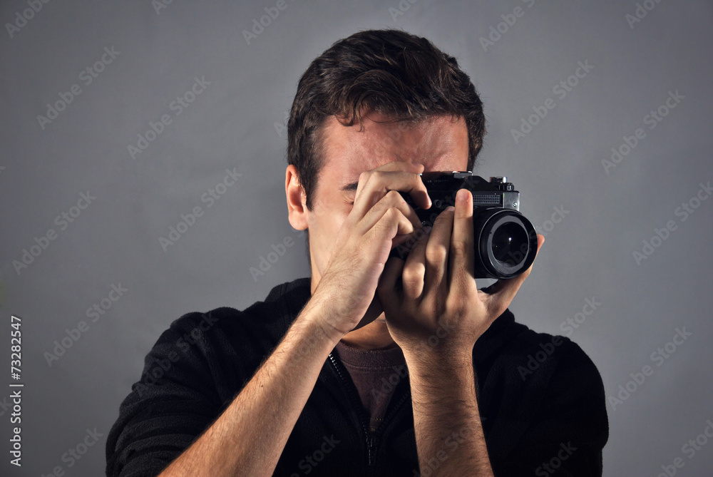 young photographer with analog camera young photographer with analog camera