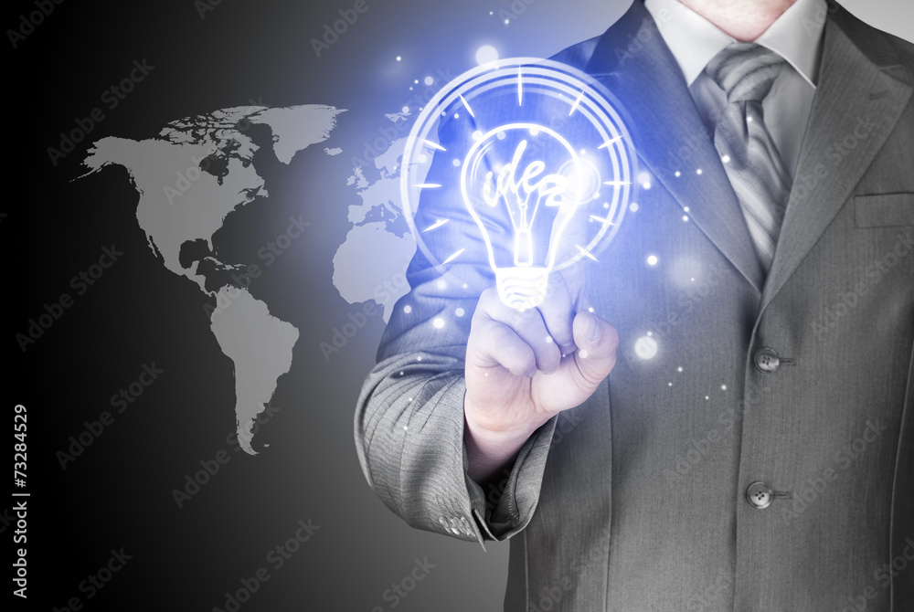 Business man touching light of idea Business man touching light of idea