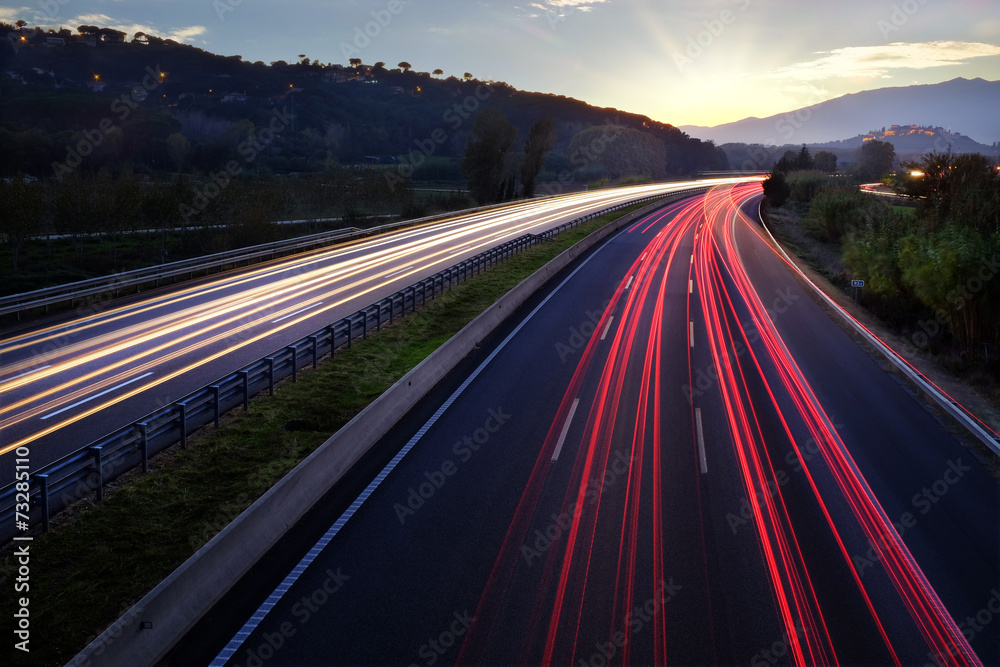 Light beams of vehicles on highway.