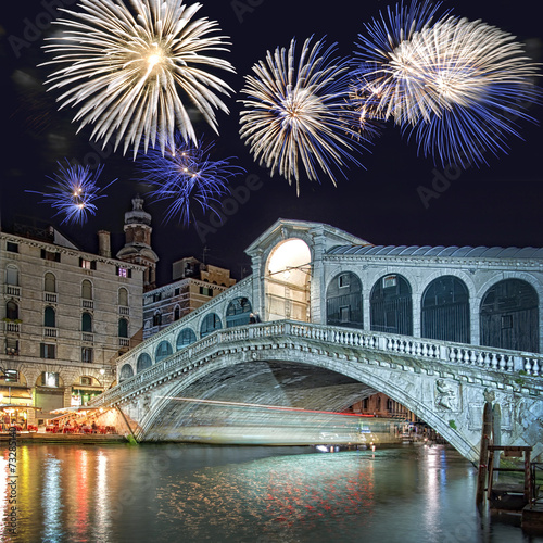 Venice Italy, fireworks over the Rialto bridge by night © Delphotostock