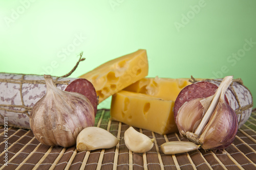 salame, garlic and laurel leaves photo