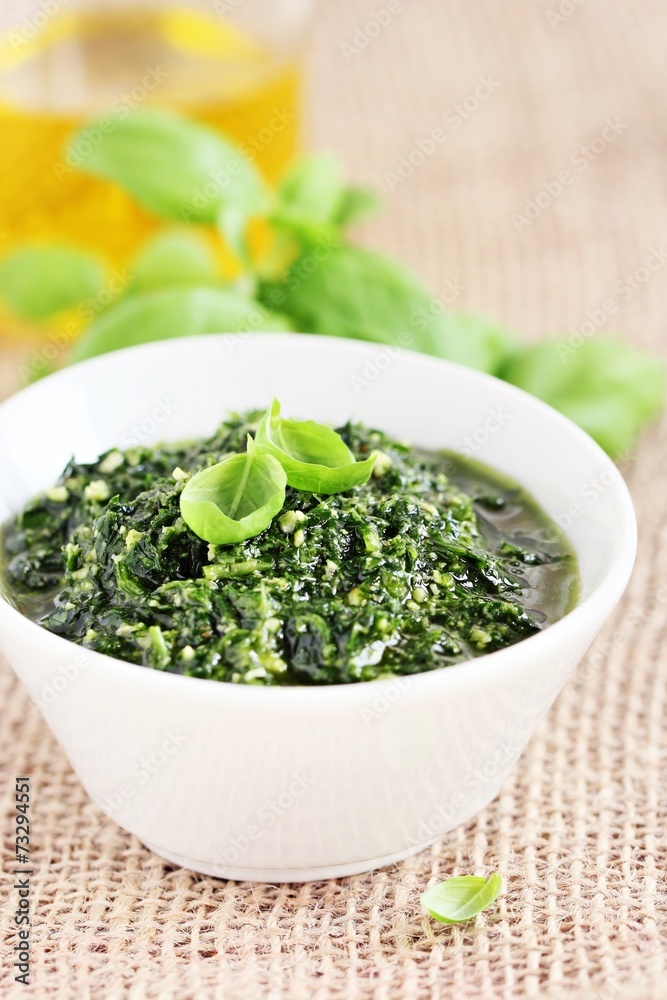 Delicious homemade pesto.Close up. Delicious homemade pesto.Close up.