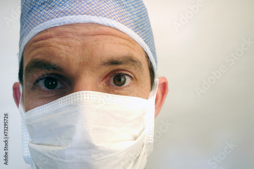 doctor in surgical mask, on white background