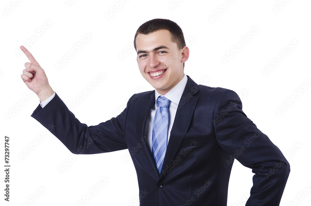 Young attractive businessman pointing isolated on white