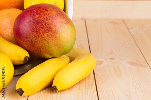 halved citrus fruit and mangos