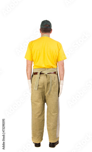 Worker in yellow workwear.