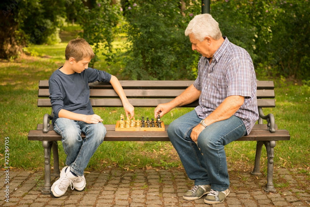 Grandfather and grandson in the park Grandfather and grandson in the park