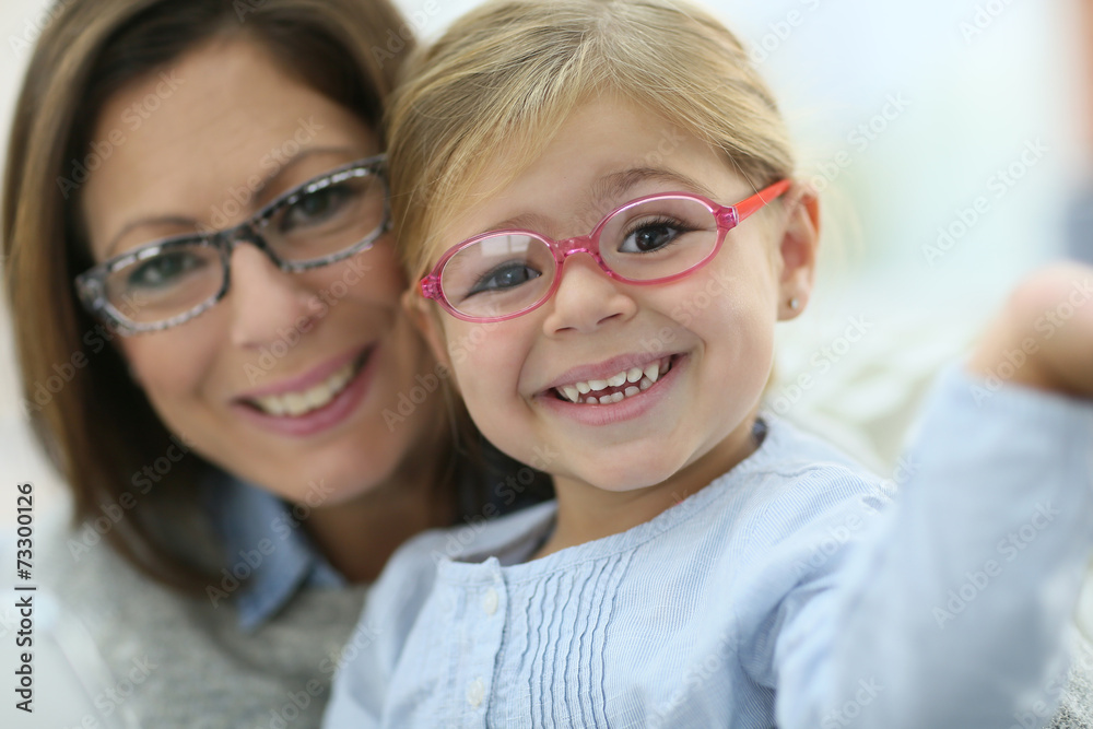 Portrait of mother and daughter wearing eyeglasses Portrait of mother and daughter wearing eyeglasses