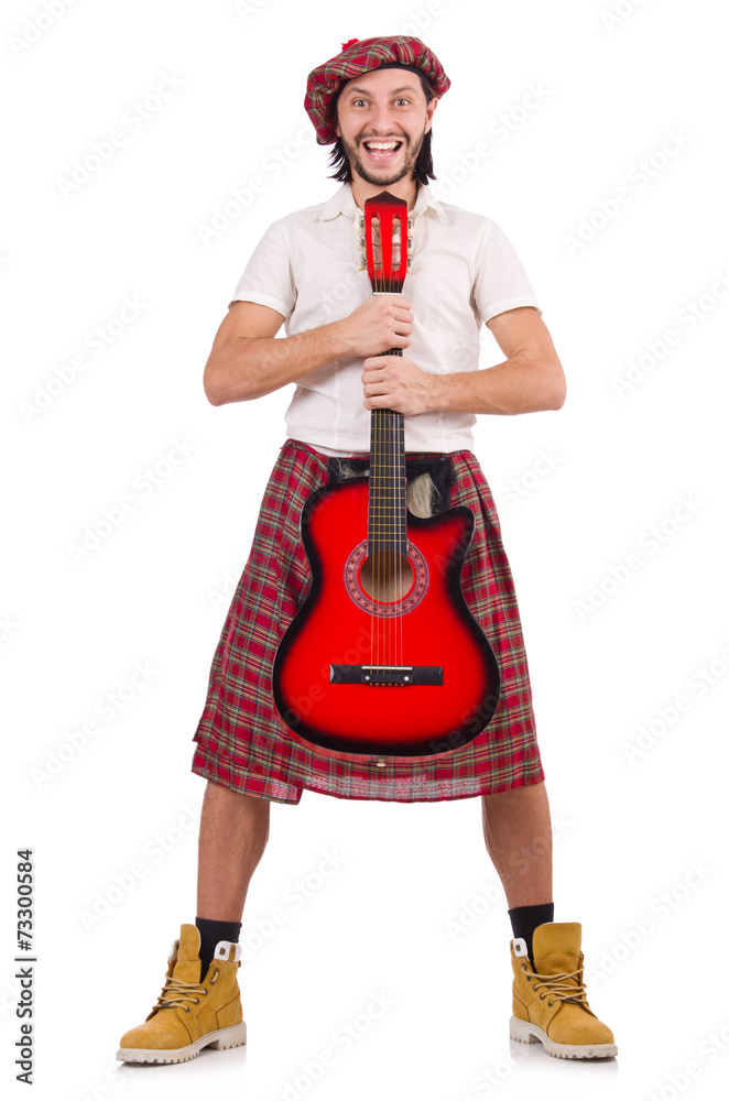 Scotsman playing guitar isolated on white Scotsman playing guitar isolated on white