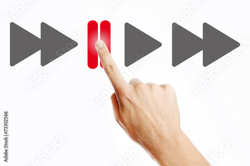 Male hand pressing pause button on the virtual screen photo