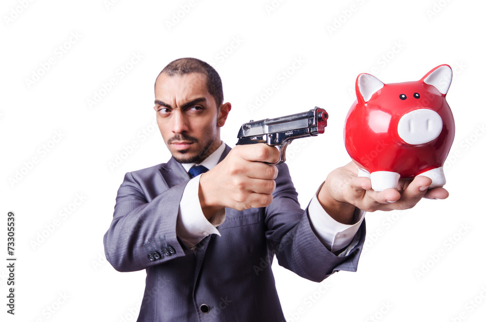 Businessman killing the piggy bank Businessman killing the piggy bank