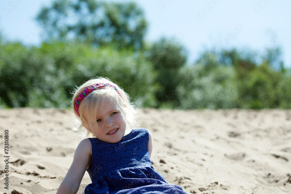 Portrait of cute blonde girl resting on beach Portrait of cute blonde girl resting on beach