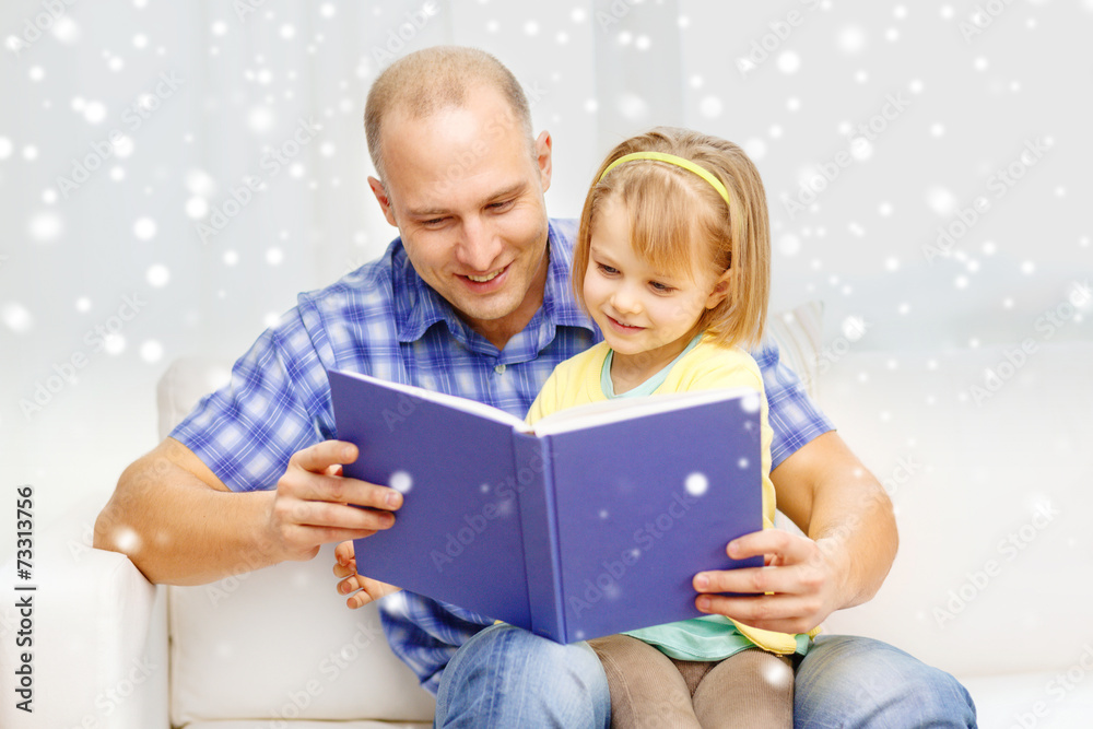 smiling father and daughter with book at home smiling father and daughter with book at home