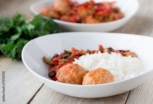 Spanish Meatballs albondigas with vegetables and cooked rice