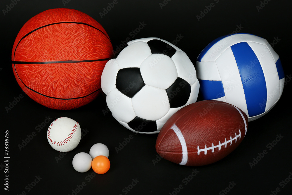 Sports balls on black background