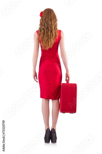 Woman in red dress and travel case isolated on white © Elnur