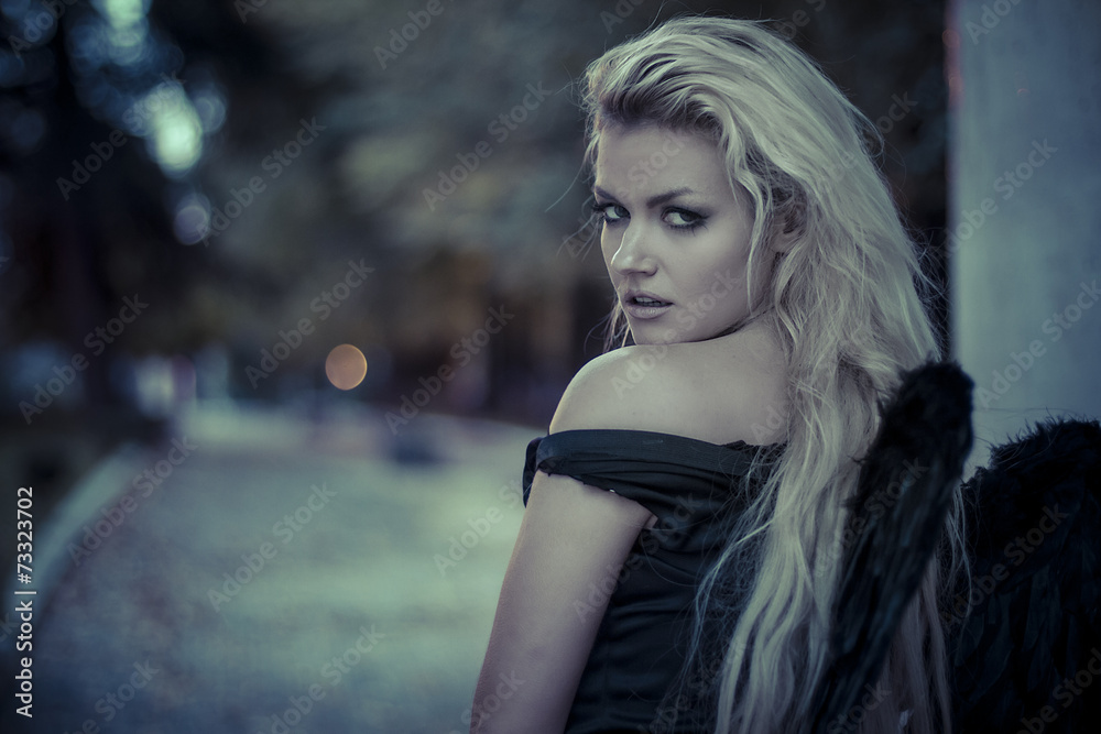 Naklejka premium purity, romantic scene, beautiful blond, fallen angel with black