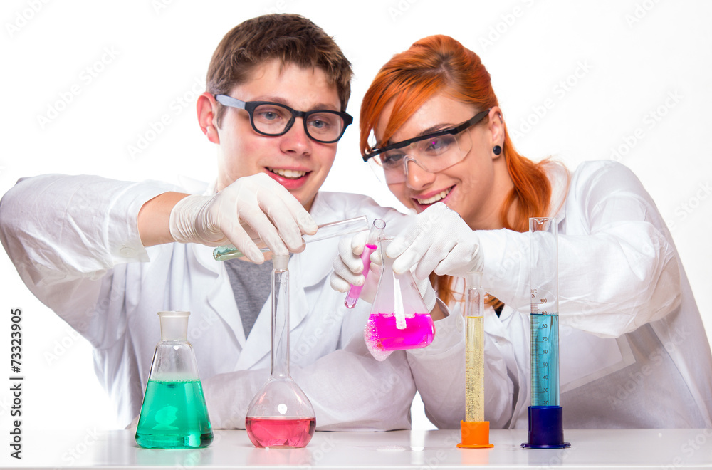 Students in chemistry lab doing reactions Students in chemistry lab doing reactions