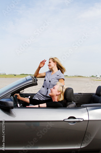 Two women driving a convertible © Trish23