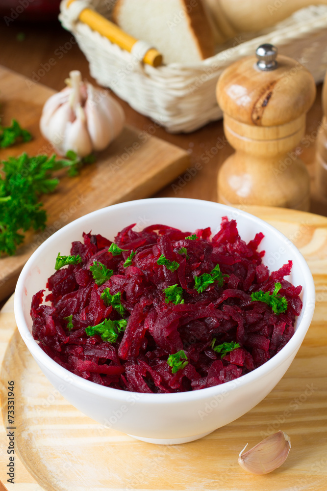 Traditional Russian salad with grated beetroot Traditional Russian salad with grated beetroot