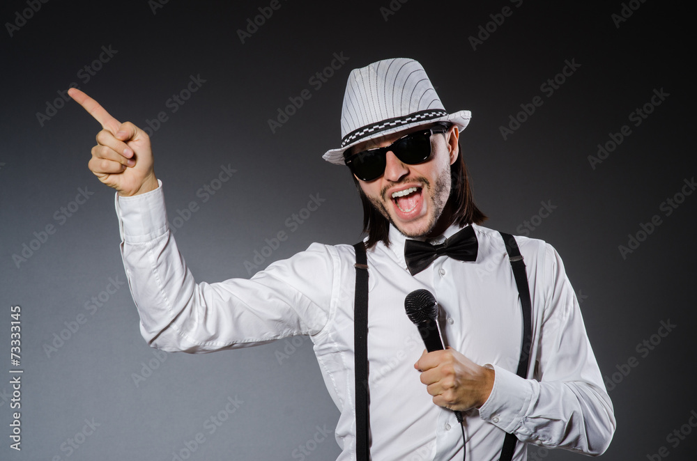 Funny singer with microphone at the concert Funny singer with microphone at the concert