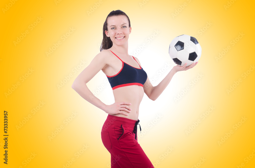 Young woman with football on white Young woman with football on white