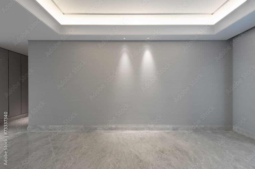 View into an empty living room with walkway View into an empty living room with walkway
