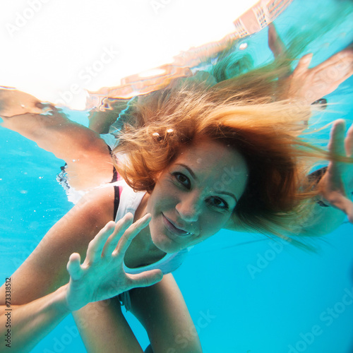 Female with eyes open underwater