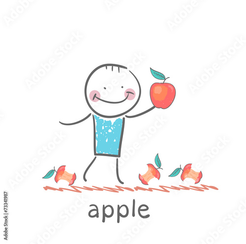 man holding an apple lying around and eats apples