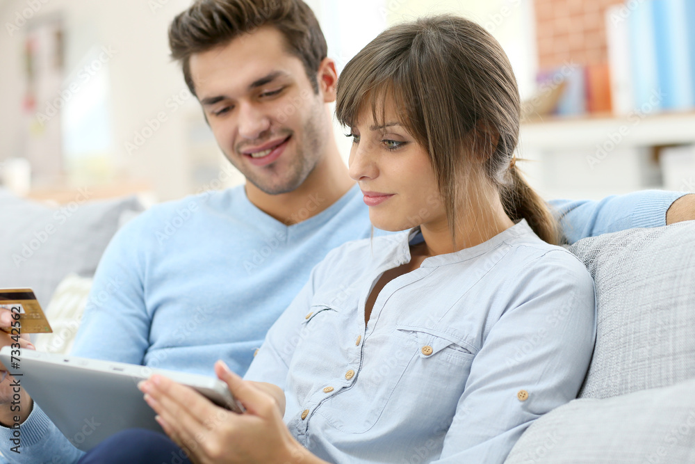 Young couple shopping on internet with tablet Young couple shopping on internet with tablet