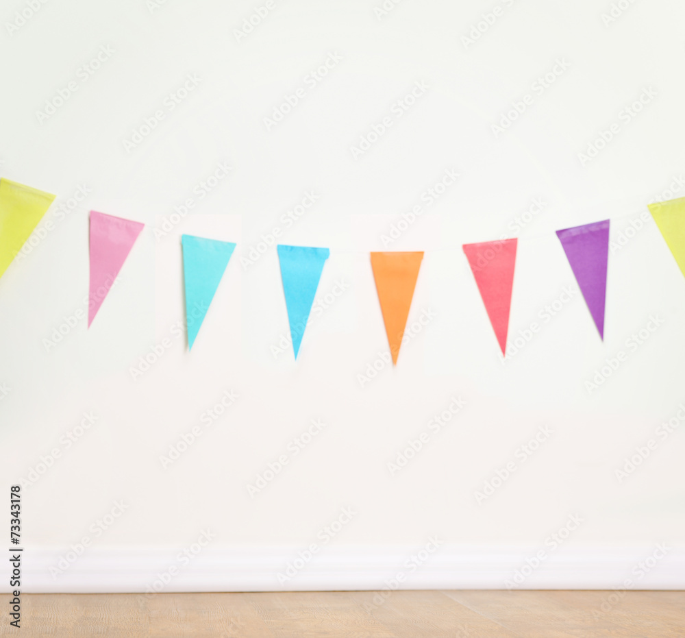 Birthday decoration flags on a plain white wall Birthday decoration flags on a plain white wall