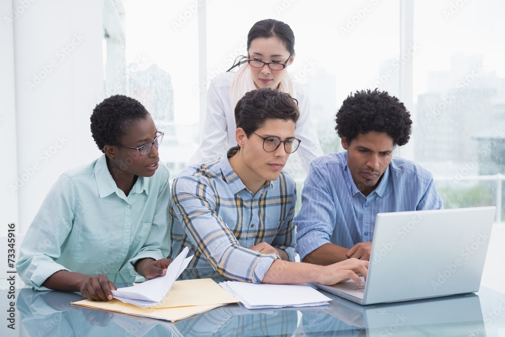 Fototapeta premium Casual business team working together at desk