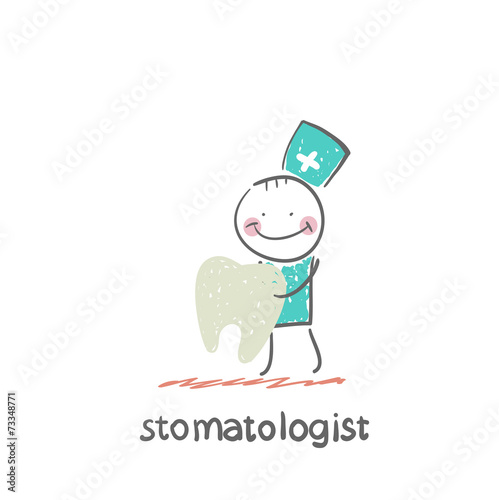 stomatologist holding a tooth