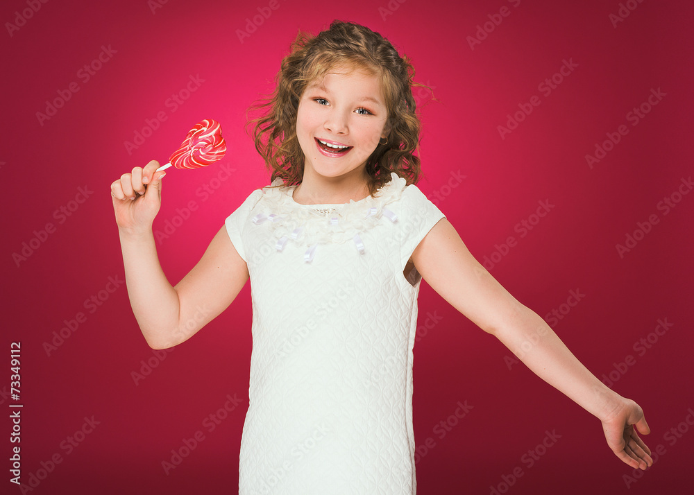 Lollipop. Heart. Candy. Little girl with lollipop in her hand Lollipop. Heart. Candy. Little girl with lollipop in her hand