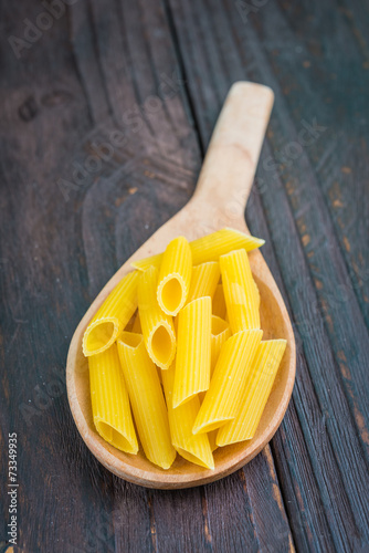 Raw pasta on spoon