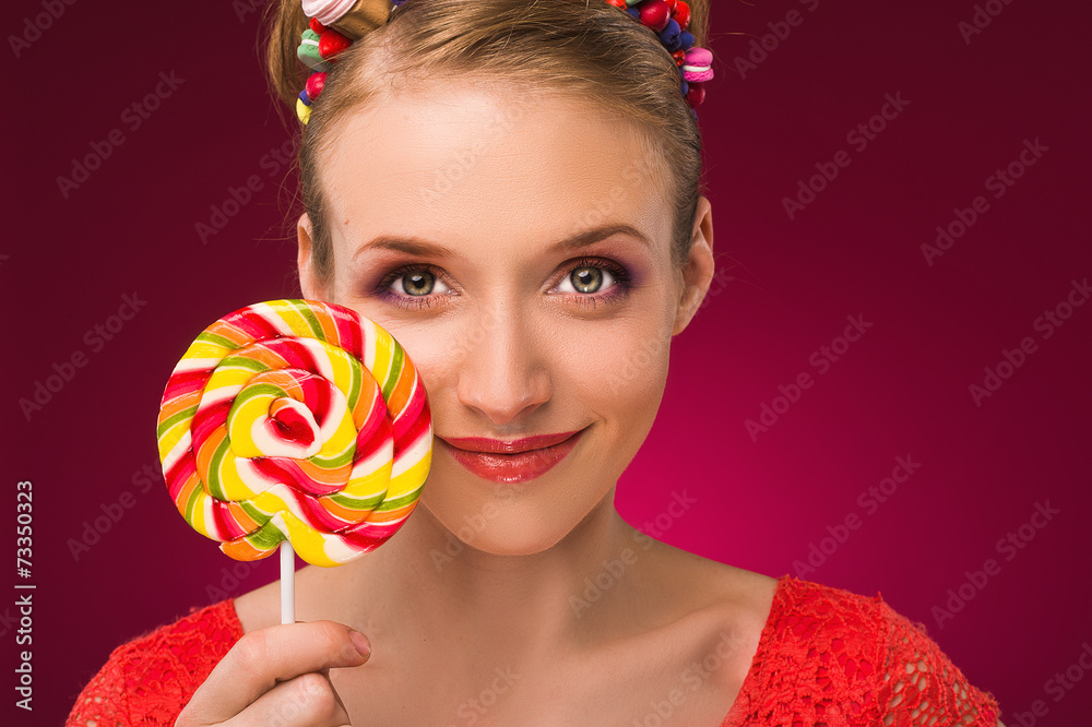Lollipop. Girl with sweet candy in their hands.