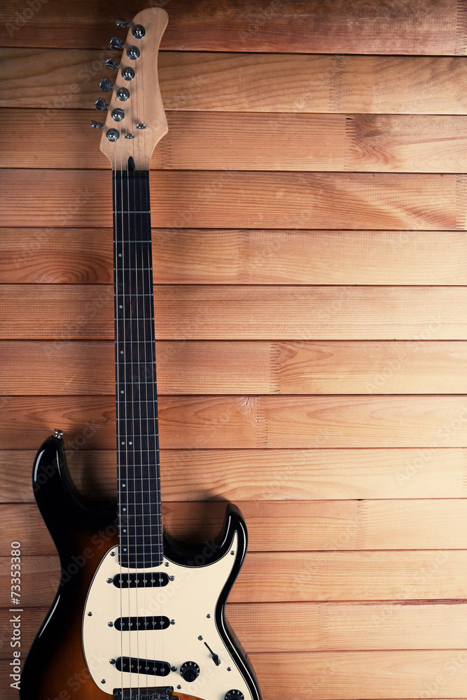 Obraz premium Guitar on wooden background