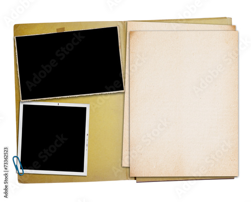 Open vintage folder with two old photographs,