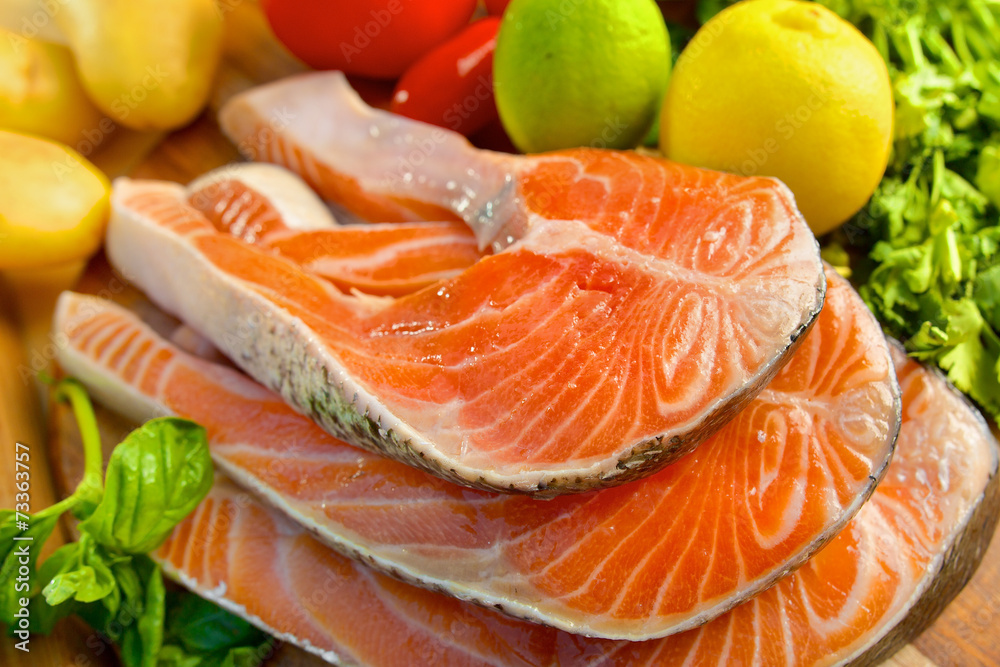 Delicious portion of fresh salmon fillet with vegetables Delicious portion of fresh salmon fillet with vegetables