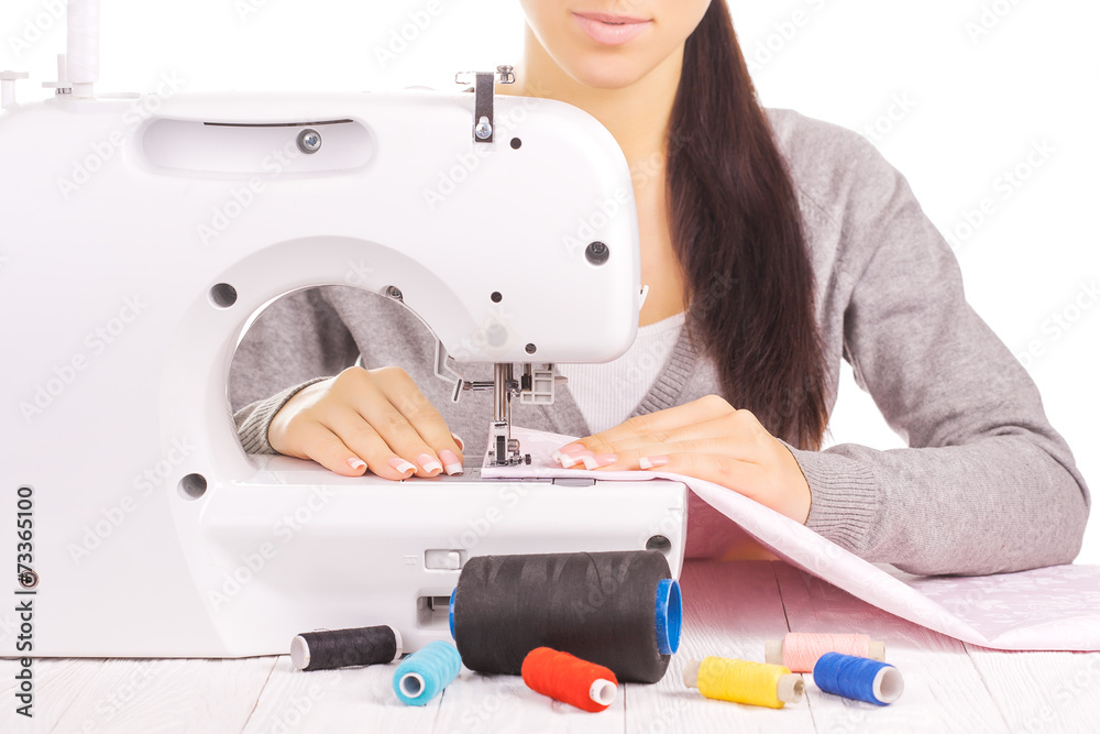 happy seamstress sewing. isolated on the white happy seamstress sewing. isolated on the white