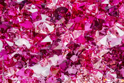 Closeup photo of many small ruby and diamond stones