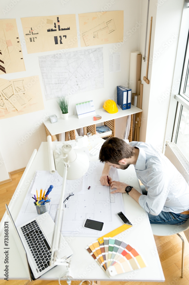 Young architect at his studio Young architect at his studio