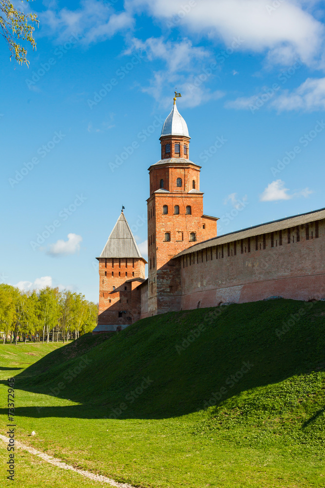 Fortress tower of red brick and wall