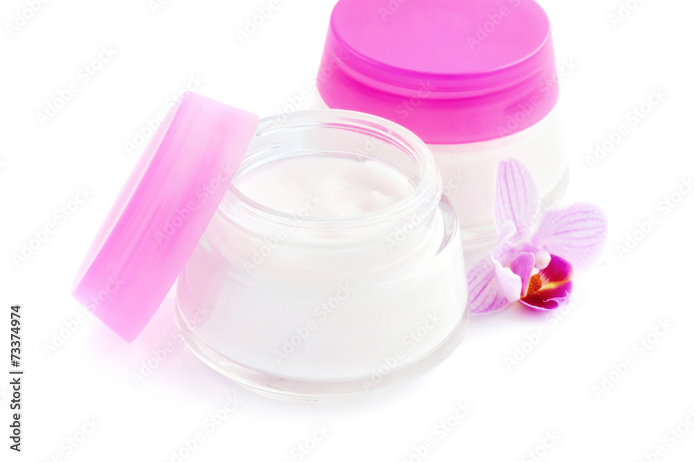 Face creams and beautiful orchid flower on white background Face creams and beautiful orchid flower on white background