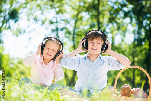 Children enjoying music © adam121