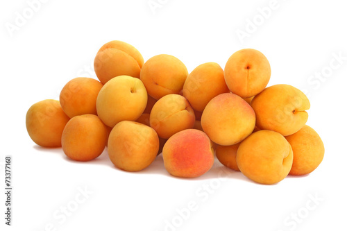 The pile of apricots isolated on white background