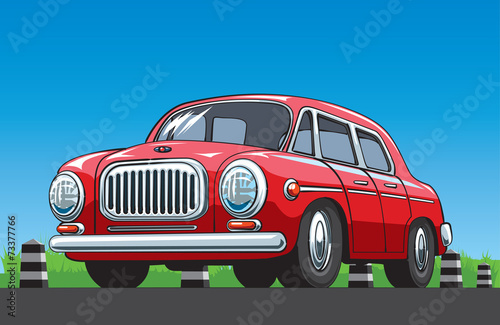 Red vintage car on the blue sky background