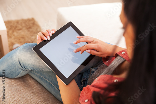 Obraz na płótnie Woman using tablet.She touching the screen.