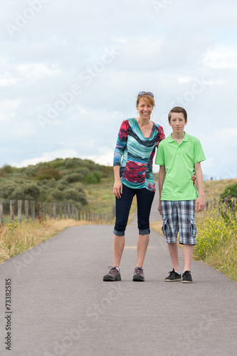 Mother and son walking in nature © benschonewille