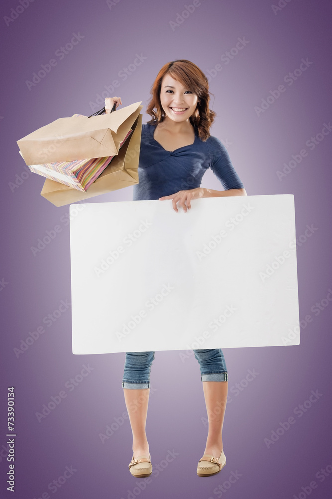 Shopping woman holding bags and blank board Shopping woman holding bags and blank board
